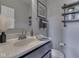 Half bathroom with a modern sink, mirror, and decor on the wall at 1215 W Curry Rd, Greenwood, IN 46143