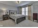 Inviting bedroom has carpet, natural light, and tasteful decor at 1215 W Curry Rd, Greenwood, IN 46143