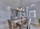 Open-concept dining room with decorative lighting and a view of the staircase at 1215 W Curry Rd, Greenwood, IN 46143