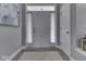 Bright foyer with grey walls, white trim, and wood-look floors at 1215 W Curry Rd, Greenwood, IN 46143