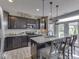 Kitchen featuring pendant lighting, granite countertops, stainless steel appliances and a breakfast bar at 1215 W Curry Rd, Greenwood, IN 46143