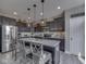 Kitchen featuring pendant lighting, gray backsplash, granite countertops, and stainless steel appliances at 1215 W Curry Rd, Greenwood, IN 46143