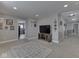 Spacious living area with neutral walls and carpet, TV, and doorways at 1215 W Curry Rd, Greenwood, IN 46143