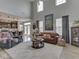 Spacious living room with high ceilings, large windows, and comfortable seating at 1215 W Curry Rd, Greenwood, IN 46143