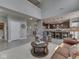 Bright open-concept living area with a modern kitchen, comfortable seating, and natural light at 1215 W Curry Rd, Greenwood, IN 46143