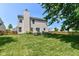 View of the home's backyard featuring a large, well-maintained lawn and patio area at 12343 Slate Dr, Fishers, IN 46037
