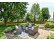 Lush backyard featuring a patio with comfortable outdoor seating and well-maintained landscaping at 12343 Slate Dr, Fishers, IN 46037
