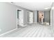 Spacious bedroom with plush gray carpeting and multiple doorways, providing flexibility and style at 12343 Slate Dr, Fishers, IN 46037