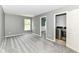 Spacious bedroom with large window, adjoining laundry room and plush gray carpeting, offering comfort and convenience at 12343 Slate Dr, Fishers, IN 46037