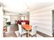 Stylish dining area with hardwood floors and an open view to the living room at 12343 Slate Dr, Fishers, IN 46037