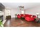 Comfortable living room with a fireplace and a plush red sectional sofa at 12343 Slate Dr, Fishers, IN 46037