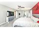 Comfortable main bedroom with a ceiling fan, and doorways to closet and bath, carpeted with a television at 12343 Slate Dr, Fishers, IN 46037