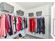 Spacious walk-in closet featuring ample hanging space, shelving, and stylish storage bins for optimal organization at 12343 Slate Dr, Fishers, IN 46037
