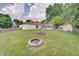 Large grassy backyard, complete with a fire pit at 12515 Traverse Pl, Fishers, IN 46038