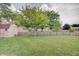 Beautiful backyard with a large grassy area and a wooden fence at 12515 Traverse Pl, Fishers, IN 46038