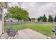 Spacious backyard with a mature tree and a patio area at 12515 Traverse Pl, Fishers, IN 46038