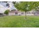 Beautiful backyard showcasing a well-maintained lawn and the home's exterior at 12515 Traverse Pl, Fishers, IN 46038