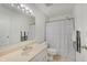 Bathroom featuring large mirror, vanity, and tiled shower at 12515 Traverse Pl, Fishers, IN 46038