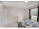 Clean bedroom with carpet, neutral walls, double hung window, and ample space at 12515 Traverse Pl, Fishers, IN 46038
