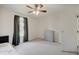 Bedroom offering a window view, dresser, and ceiling fan at 12515 Traverse Pl, Fishers, IN 46038