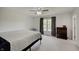 Spacious bedroom with a ceiling fan, natural light, and a dresser at 12515 Traverse Pl, Fishers, IN 46038