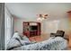 Cozy living room with comfortable sofa, entertainment center, and hardwood flooring at 12515 Traverse Pl, Fishers, IN 46038