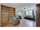 Inviting living room featuring a comfortable sectional sofa and a built-in bookshelf at 12515 Traverse Pl, Fishers, IN 46038