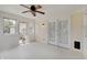 Relaxing sunroom featuring a ceiling fan and door to outside at 12515 Traverse Pl, Fishers, IN 46038