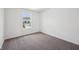 Bedroom with carpet and a double hung window overlooking a large yard at 1304 Vera Blvd, Danville, IN 46122