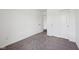 Cozy bedroom featuring plush carpeting, a large closet with sliding doors, and ample natural light at 1304 Vera Blvd, Danville, IN 46122