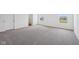 Large carpeted bedroom with two windows allowing natural light at 1304 Vera Blvd, Danville, IN 46122