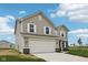 Well-maintained two-story house featuring a two-car garage, lush lawn, and pristine landscaping at 1304 Vera Blvd, Danville, IN 46122