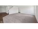 Spacious living room with neutral carpet, white walls, a staircase and entryways at 1304 Vera Blvd, Danville, IN 46122