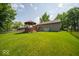 Large backyard featuring a well-maintained lawn, gazebo, and plenty of room for outdoor activities at 13910 Brightwater Dr, Fishers, IN 46038