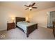 Cozy bedroom with a ceiling fan, carpeted floor, and neutral decor at 13910 Brightwater Dr, Fishers, IN 46038