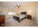 Comfortable bedroom with a ceiling fan, carpeted floor, and neutral decor at 13910 Brightwater Dr, Fishers, IN 46038