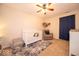 Bedroom with a crib, cozy chair, and a playful stuffed animal hammock at 13910 Brightwater Dr, Fishers, IN 46038
