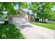 Charming single-story brick home with an attached two-car garage and mature landscaping at 13910 Brightwater Dr, Fishers, IN 46038