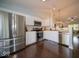 Well-lit kitchen featuring stainless steel appliances and white cabinets at 13910 Brightwater Dr, Fishers, IN 46038