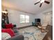 Comfortable living room features neutral walls, large window, and inviting seating arrangement at 13910 Brightwater Dr, Fishers, IN 46038