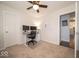 A spacious office area featuring a ceiling fan, dual monitors, and doorway to another room at 13910 Brightwater Dr, Fishers, IN 46038