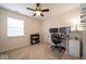 A comfortable office space featuring a ceiling fan and large window for natural light at 13910 Brightwater Dr, Fishers, IN 46038