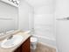 Bathroom featuring modern fixtures, a wood vanity, and white cabinets at 1525 Bluestem Dr, Greenwood, IN 46143