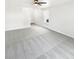 Bright living room showcasing plush carpeting, a ceiling fan, a staircase, and a large window for natural light at 1525 Bluestem Dr, Greenwood, IN 46143