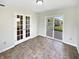 Sunroom featuring tile flooring, double doors, and a slider to the backyard at 1525 Bluestem Dr, Greenwood, IN 46143