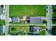 A full aerial view of a modern home, garage, greenhouse, and fence at 1622 Cornell Ave, Indianapolis, IN 46202