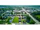 An aerial view of houses, buildings, streets, and green trees at 1622 Cornell Ave, Indianapolis, IN 46202