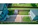 Beautiful backyard with a greenhouse, wooden fence, and manicured lawn at 1622 Cornell Ave, Indianapolis, IN 46202
