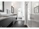 Stylish bathroom with dual sinks and a glass enclosed shower at 1622 Cornell Ave, Indianapolis, IN 46202