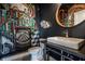 Modern bathroom features a unique graffiti wall mural and sleek fixtures at 1622 Cornell Ave, Indianapolis, IN 46202